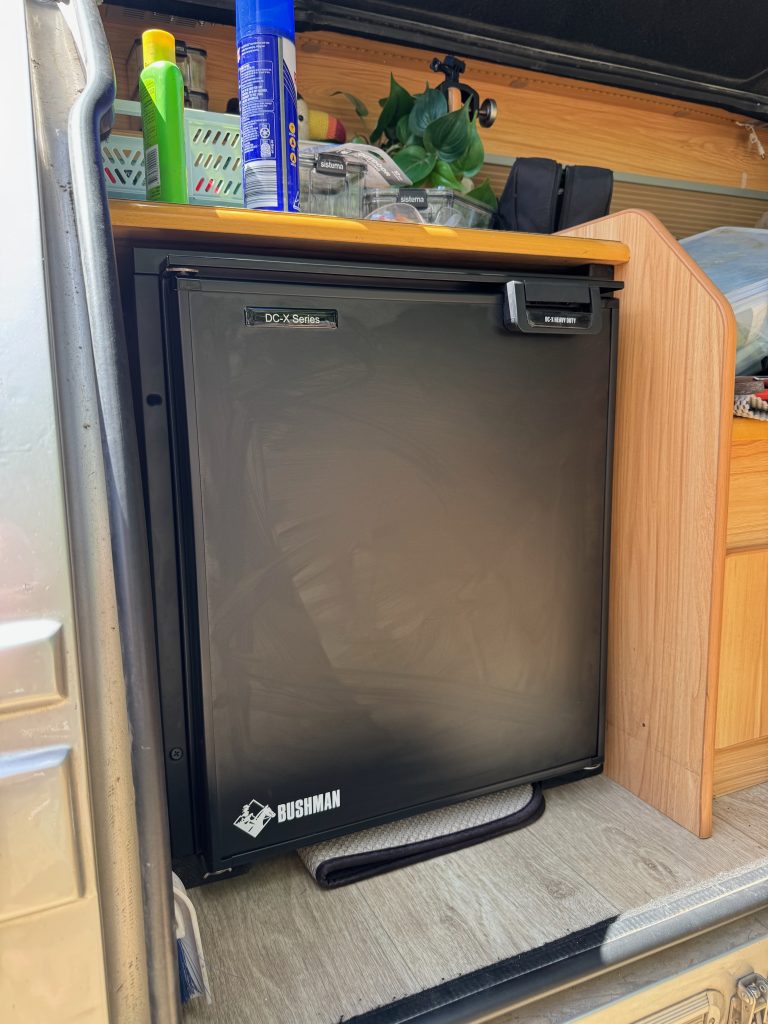 We installed a Bushmans 65 litre upright fridge in our teardrop. Here’s how!